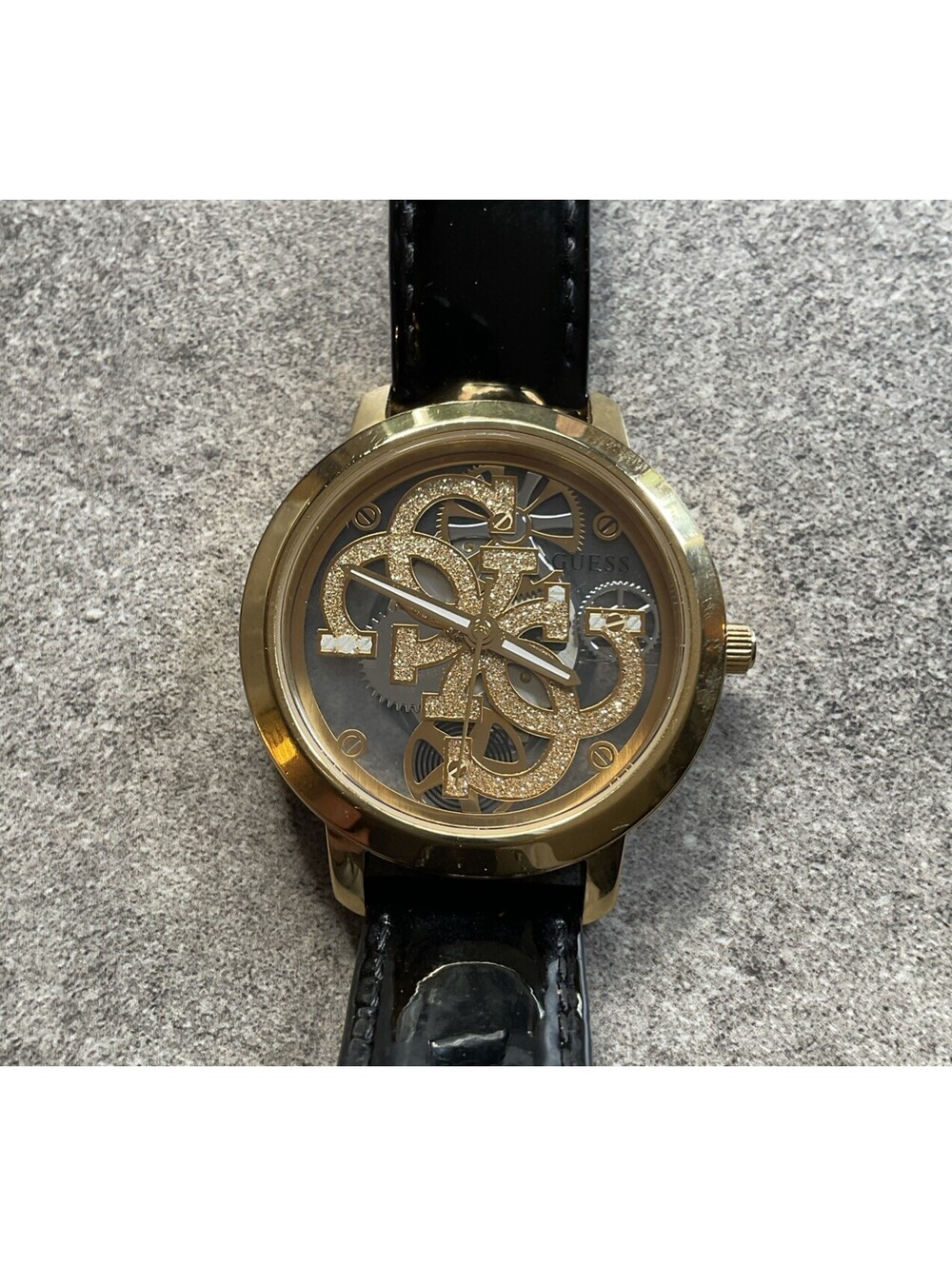 Guess Quattro Skeleton Dial 36mm Gold Tone Case Black Leather Band A19